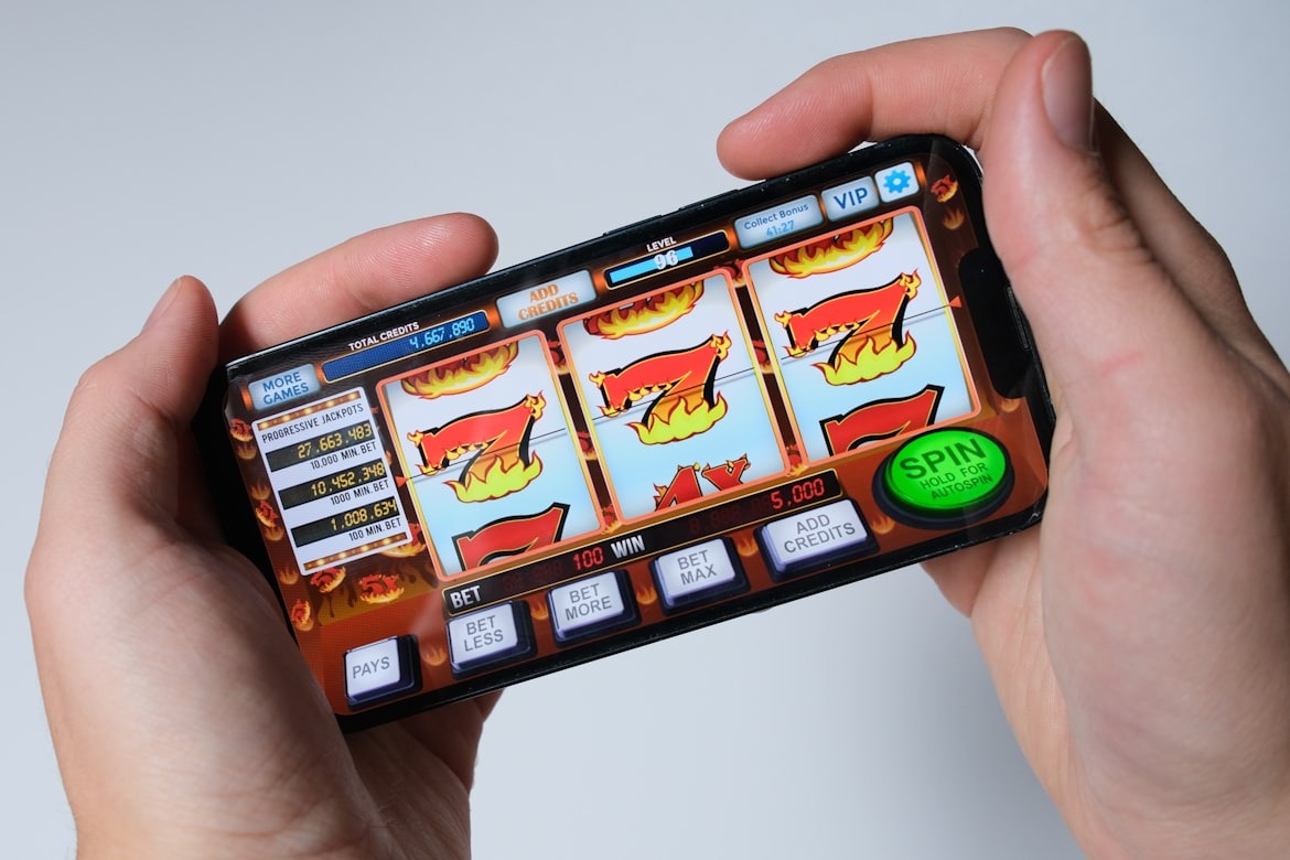 Someone is playing a mobile slot machine game